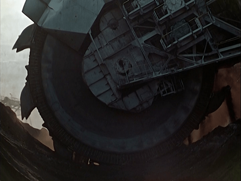 A bucket wheel excavator is operating in the rhenish lignite mining area