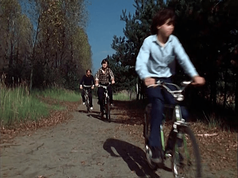 Children cycling through a newly reclamated landscape